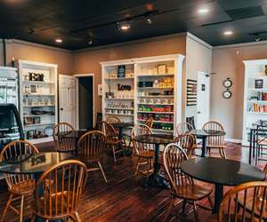 Indoor seating, cafe, coffee shop, bookshelf 